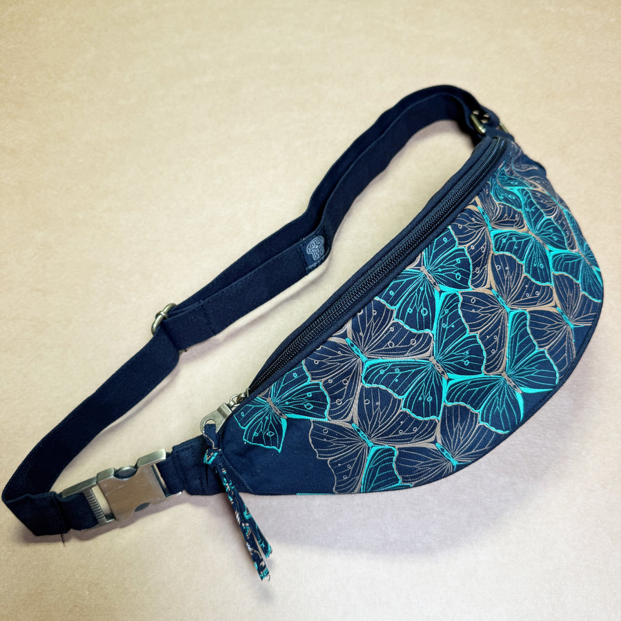 Butterfly Morph Canvas Fanny Pack - turquoise metamorphosis pattern on navy canvas by Symbolika