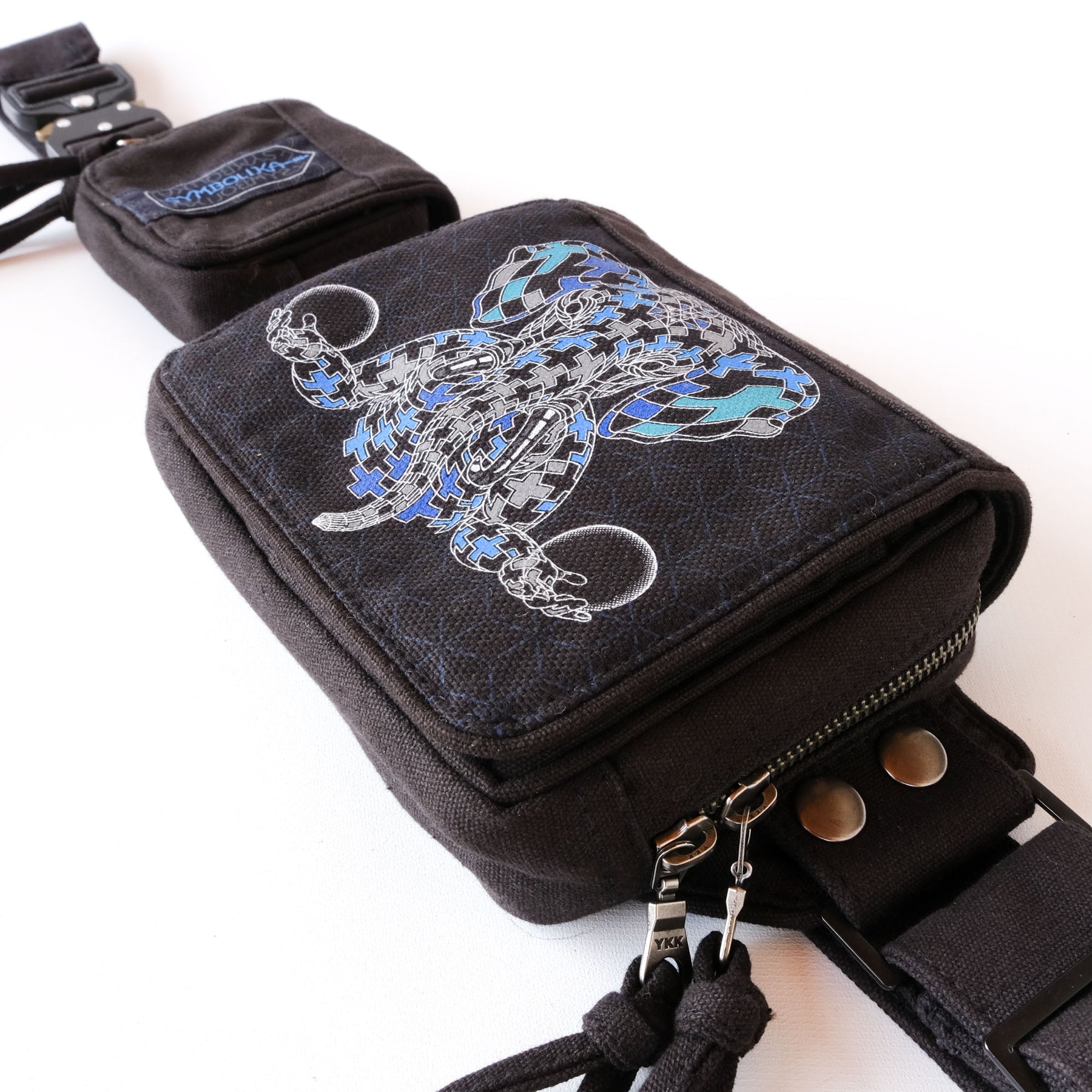 UV reactive Ganesha tessellation belt bag glowing blue under blacklight by Symbolika