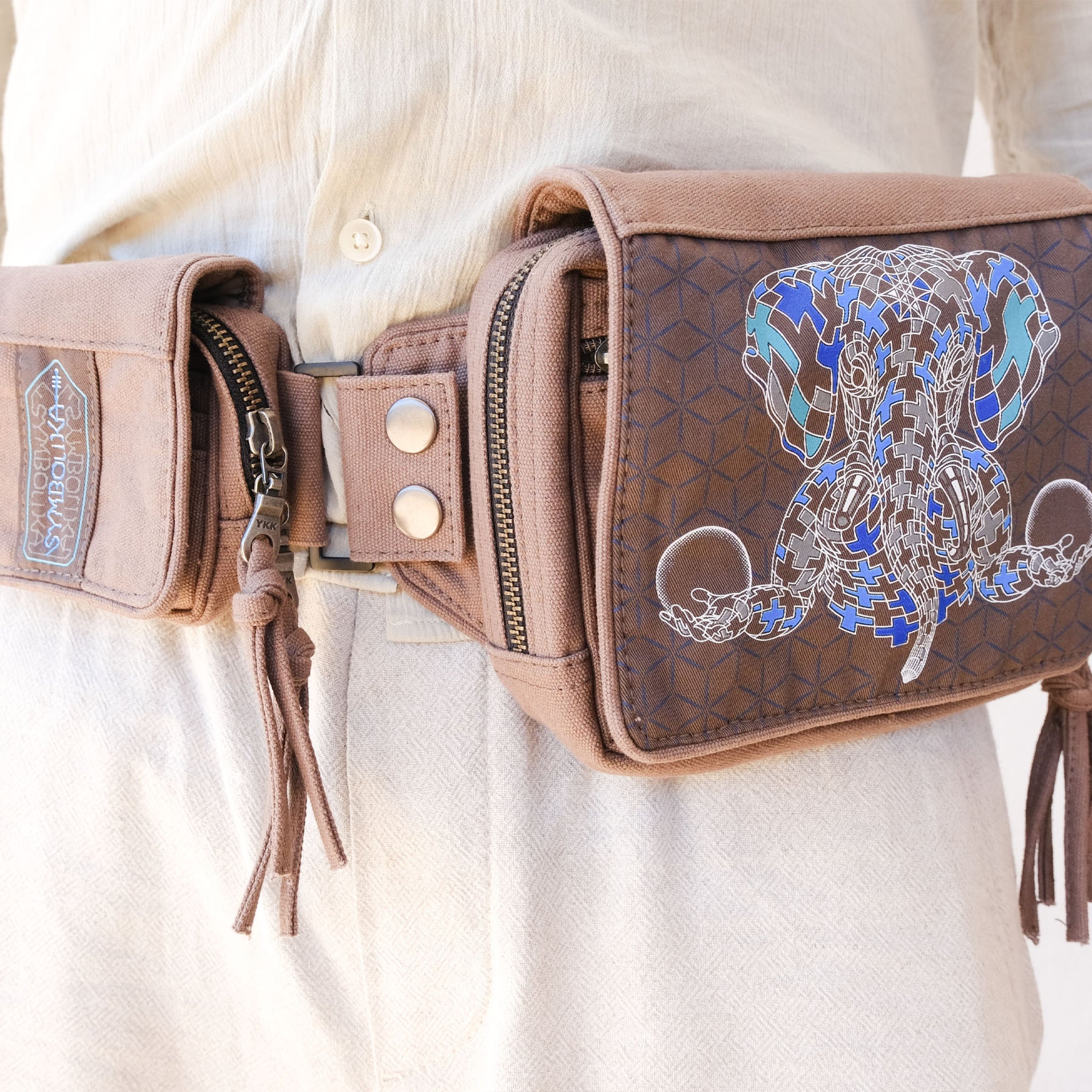 UV reactive Ganesha belt bag glowing blue-green under blacklight by Symbolika