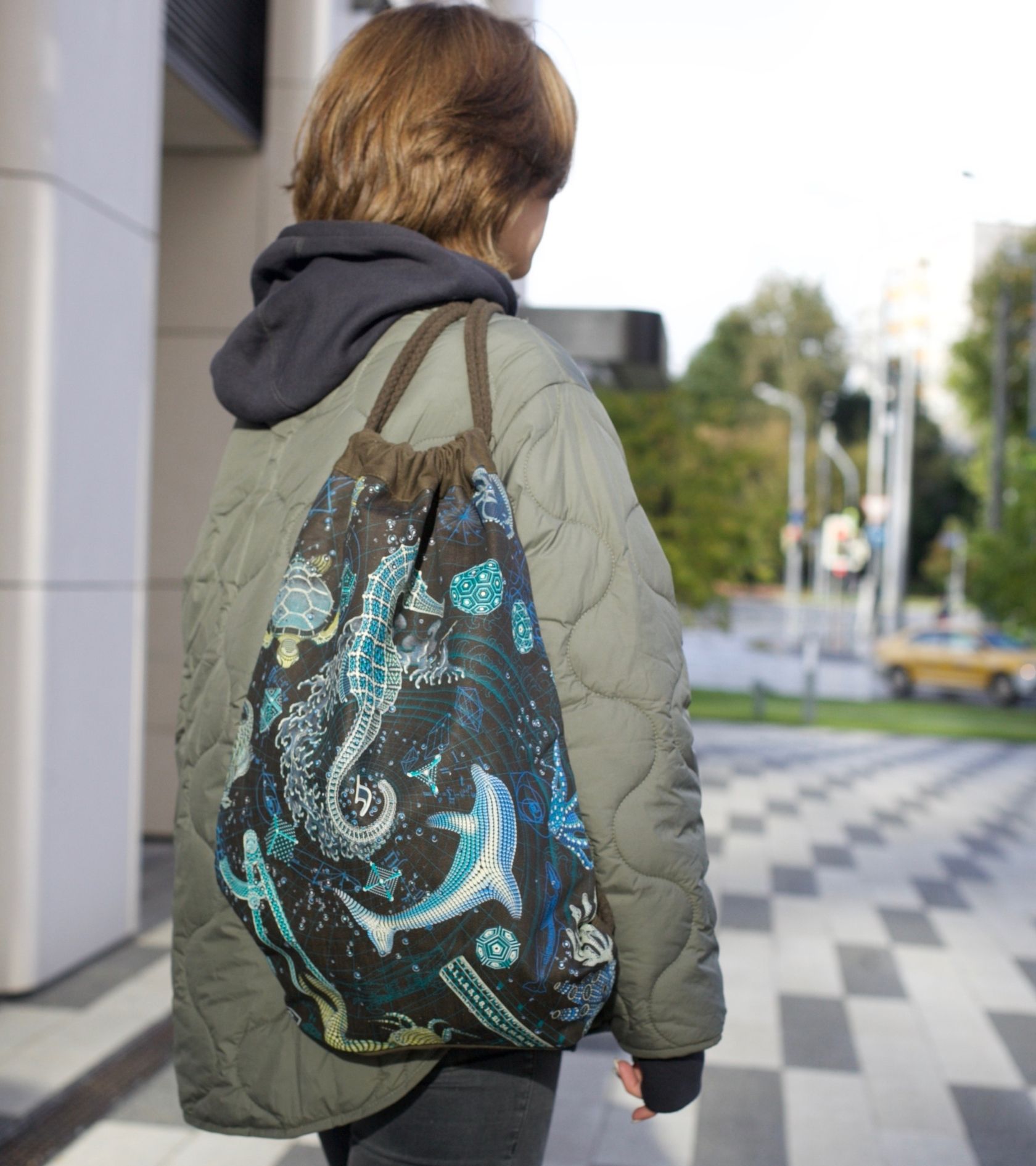 Blueprint 2 SEA drawstring bag - serpentine geometric art on brown canvas by Symbolika