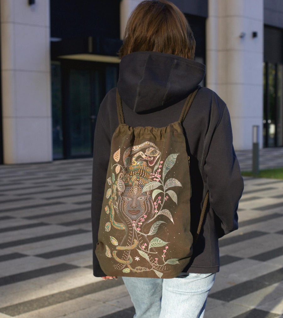 Aya Drawstring Bag - Mother Ayahuasca face with leaf patterns on khaki canvas by Symbolika